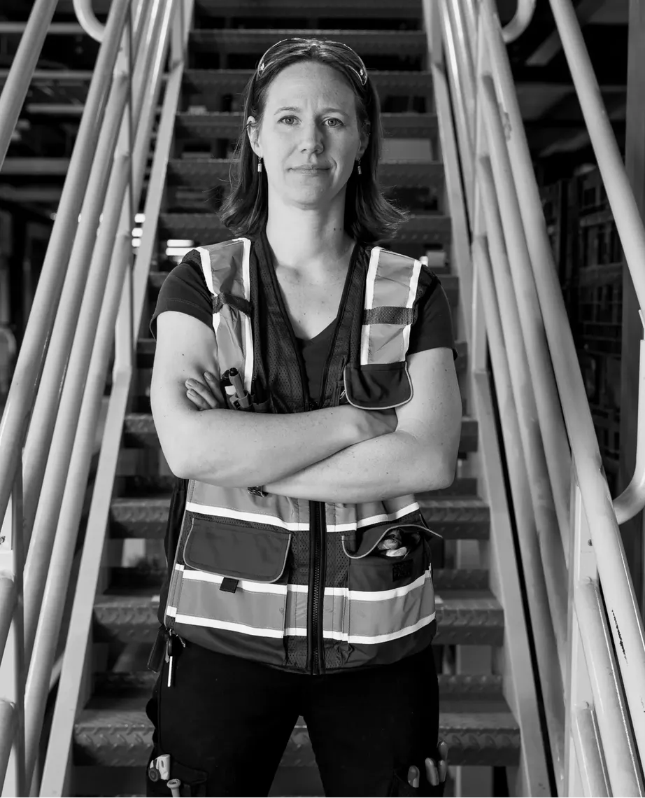 woman standing with arms crossed in front of her