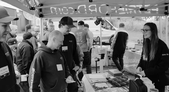 group of people at booth