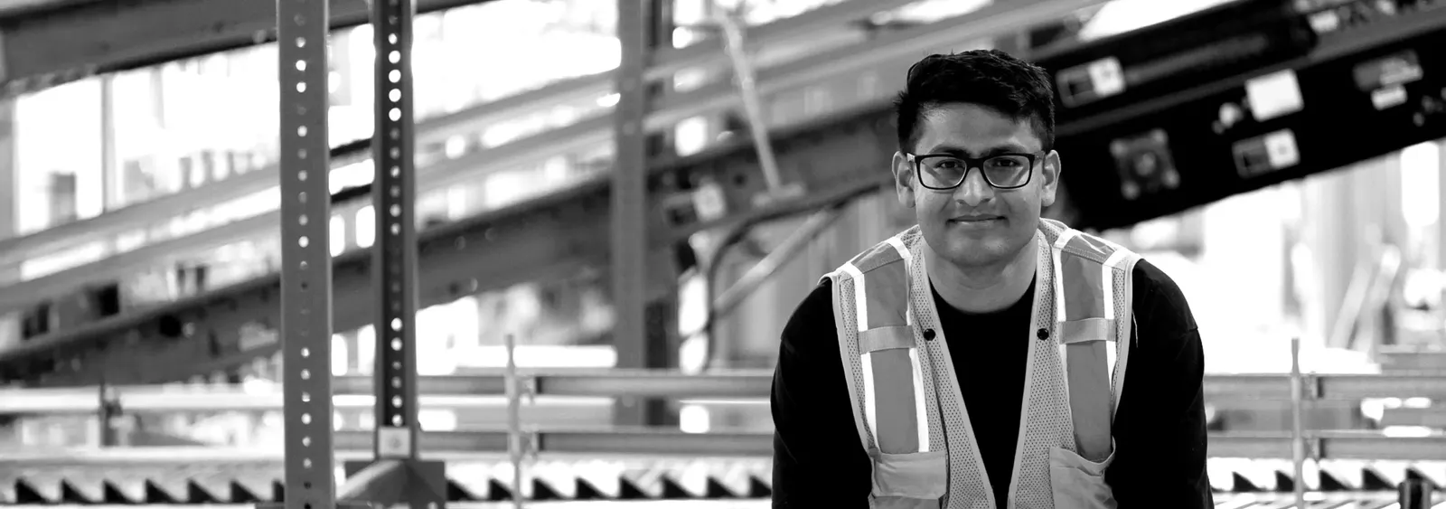 man with glasses smiling